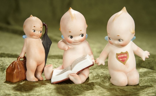 3 1/2" - 4" Three German all-bisque action Kewpies in playful poses. $500/700