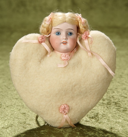 8" All Original German bisque doll with heart-shaped flannel pincushion body, original wig. $300/400