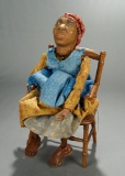 American Carved Wooden Black Doll/Puppet in Chair 400/500