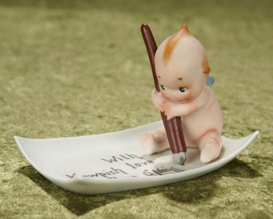 4.6"l. tray. German all-bisque seated Kewpie on "With Kewpish Love" tray. $400/500