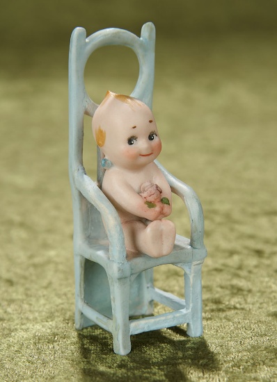 4" German all-bisque seated Kewpie with rosebud on high-back chair. $400/500