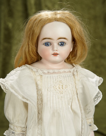 20" German bisque child doll by Kestner with very lovely antique costume. $300/400