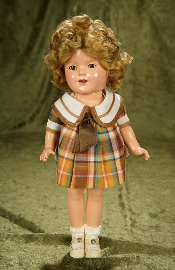 13" American composition child doll by Shirley Temple in original costume. $400/500