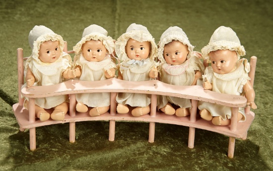 7" Set, American composition Dionne Quintuplets, original bench with embroidered bibs. $900/1100