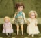 Three small German bisque dolls in various styles, nicely costumed
