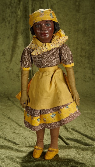22" American brown complexioned cloth doll with painted features.