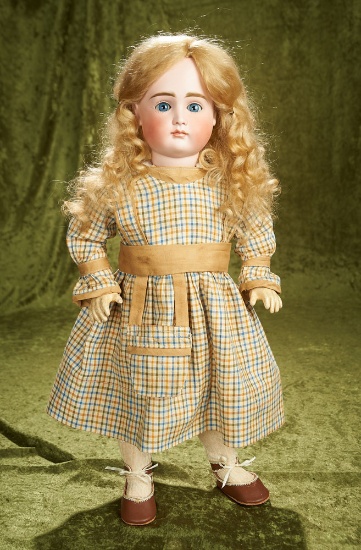 21" German bisque closed mouth doll by Kestner with wistful expression. $1200/1400