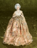 German porcelain half-doll with rare necklace, with fitted skirt cover