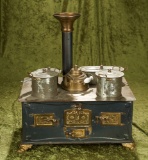 German tin kitchen stove with brass trim and all-original fitted pots and pans.