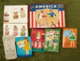 Large lot of early and vintage paper dolls, many in original packages or boxes.