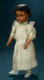 French Brown-Complexioned Bisque Doll by Jumeau, Original Costume and Signed Shoes 2800/3200