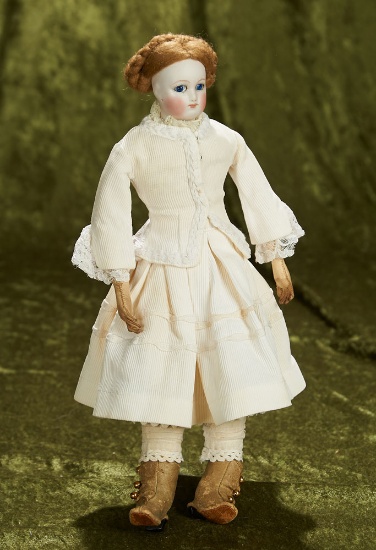 12" French bisque poupee with cobalt blue glass eyes and pique costume. $1100/1300