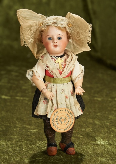 8" French bisque bebe with rare Exposition label, original costume by Unis France. $700/900