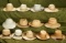 Thirteen doll-sized woven salesman sample hats with original store labels and prices