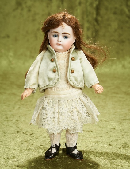 11" German bisque closed mouth doll, size 5, by Kestner  $1100/1300