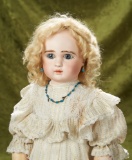 French bisque bebe, Figure A, by Jules Steiner with charming shy expression  $2400/2800