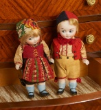 Pair, German All-Bisque Googly Dolls with Original Costumes 500/800