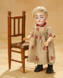 German Bisque Character, 143, by Kestner with Antique Chair 400/500