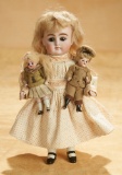 Large German All-Bisque Doll with Her Two Dolls 600/800