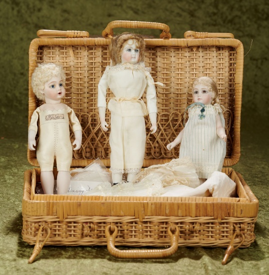 7"-9" Three bisque artist dolls by Cathy Hansen including bebe Bru in basket with costumes