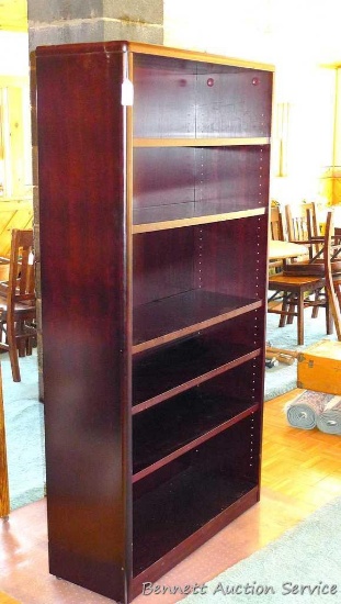 Bookcase with five adjustable shelves. Stands 68" tall x 36" wide x 13" deep. Bookcase is in overall