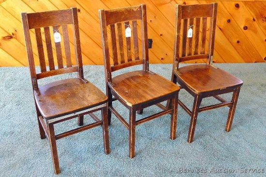 Three hardwood office chairs with iron braces are both sturdy and comfortable. Matches Lot #1 & 3.