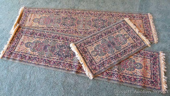 Two runners, plus one smaller rug. Two runners measure 2'x8', one has a small paint spot/stain. One