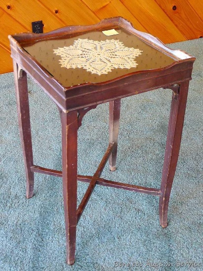 Glass topped wooden table is great for displaying ephemera or linens. Approx. 18" x 18" x 28" tall.