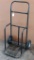 Commercial duty hand truck with hard tires. Stands approx. 4 ft. tall. Lift platform is 1-1/2'