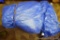 Large blue tarp - we did not unroll it. Measures 4' long by approx. 2' wide by 1' high.