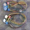 Two Robinair commercial air conditioning gauges recovery and filling gauges.