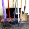 Two brooms, flat snow shovel, hoe, leaf rake, garden rake and doggie shovel and scoop.