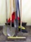 Eight yard tools incl. leaf rake, two brooms, garden rake, two spade shovels, spade and snow shovel.