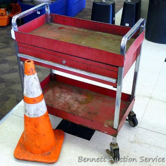 Rolling tool cart with pull out drawer, approx. 16" x 30" x 32" high. Construction cone with