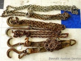 Four tie down chains, one strap and one other chain. Both straps are torn.