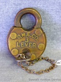 Antique padlock with key. Stamped O.M.E.CO. 3 Lever.