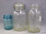 Two Atlas canning two quart jars, one with bail top; Ball pint jar. Pint jar has small chip on rim.