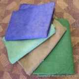 Four outdoor carpets. Works great for outside your camper. Larger green carpet is 6' x 8'.