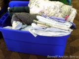 Sterlite 122 qt tote and lid filled with garden blankets and sheets.