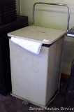 Commercial rolling laundry cart with towels/rags. Foot pedal operation. Measures approx. 19