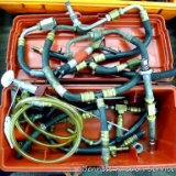 Assorted air conditioning hoses and connectors in case.