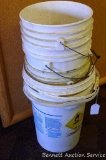 Four 5 gallon pails, one larger pail and more.