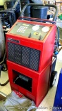Robinair air conditioning recovery, recycling and recharging unit for R-12 and R-134a with cover.