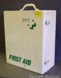 Zee metal first aid cabinet with some supplies. Approx. 13