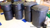 Three Rubbermaid Roughneck 45 gallon garbage cans with wheels and one other. All have lids. One lid