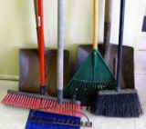 Two brooms, garden rake, two flat bottom shovels and leaf rake with broken tooth.