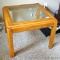 Hardwood and glass end table is in good condition and matches lot #325 and #314. Measures 26