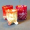 Two Imperial Glass red slag glass toothpick holders No. 1, plus one Kanawha Glass Co. slag glass