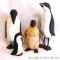One Ceramic and Three Wooden Penguins, largest is 8.5