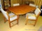 Nice table and chair set. Chairs are on casters. Table measures 5' x 42